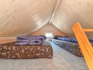 a room with two beds in a attic at Bleubird in Ellemeet +24 photos