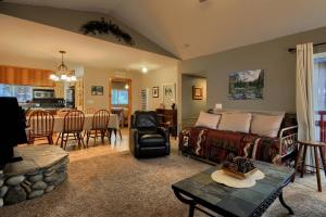 a living room with a bed and a dining room at Hibernation Hideaway- Inside Yosemite- Dog Friendly in South Wawona