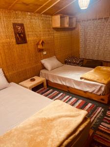 a room with two beds in a room at Genena Eco-lodge in Nuweiba