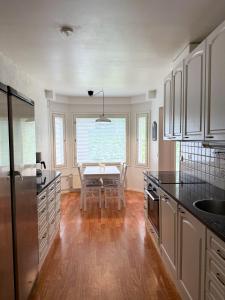 a kitchen with a table and a dining room at Aurora Nest in Rovaniemi