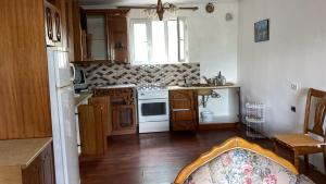 a kitchen with a sink and a stove top oven at Flowers House in Gjirokastër +40 photos