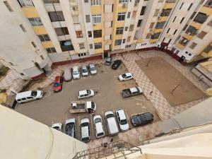 an aerial view of a parking lot with parked cars at Café de Mazagran in Mostaganem
