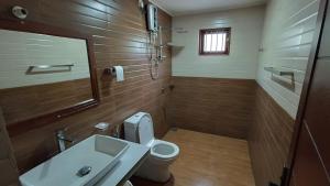 a bathroom with a sink and a toilet at Mihinsa Guest in Kosgoda +34 photos