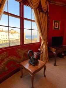 a room with a room with a dragon on the wall at 12A Regency Square in Brighton & Hove