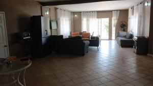 a living room with couches and a couch and a table at Kiki bay in Conakry