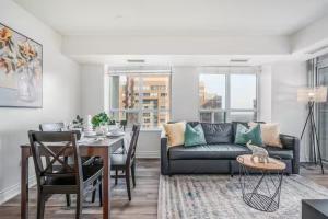 a living room with a couch and a table at Mississauga Downtown Condos in Mississauga