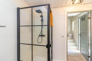 a shower in a bathroom with a glass door at VMA812-Kolsva-Lomstigen-7 in Kolsva +37 photos