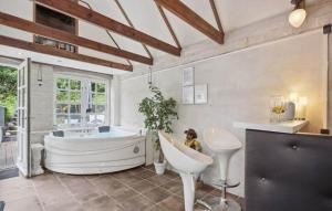 a large bathroom with a tub and a sink at AE329-Aeroskobing-Oster-Bregninge-24 in Ærøskøbing +15 photos