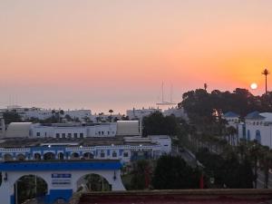 a view of a city with the sunset in the background at mdiq in M'diq