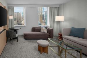 a living room with a couch and a chair at The Westin Minneapolis in Minneapolis