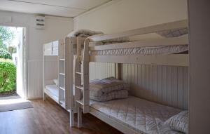 a couple of bunk beds in a room at Gorgeous Home In Ystad in Ystad
