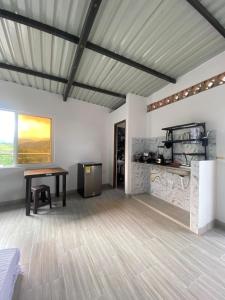 a living room with a table and a fireplace at Ambar Apartahotel - Clasico in San Luis