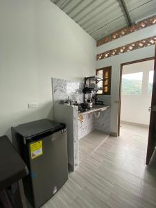 a kitchen with a sink and a counter top at Ambar Apartahotel - Clasico in San Luis +13 photos