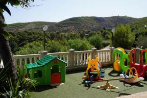 a group of childrens play equipment on a lawn at Appartamenti Serena in Peschici