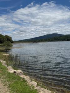 a large body of water with mountains in the background at Casa do camiño in Villariño +7 photos