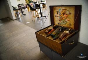 a wooden chest filled with lots of bullets at Casa Diamante Viñedos in Ezequiel Montes +36 photos