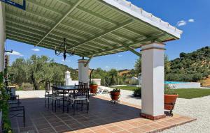 a pergola with a table and chairs on a patio at 4 Bedroom Awesome Home In Constantina in Constantina +24 photos