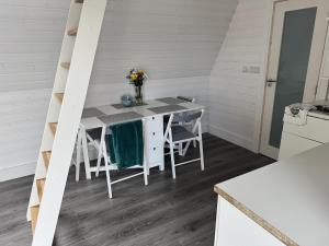 a kitchen with a table and chairs in a room at Han's Solo 75 in Athenry +5 photos