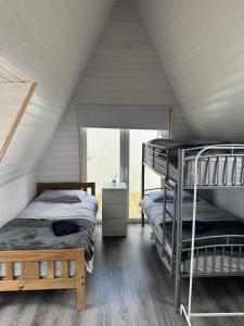a bedroom with two bunk beds in a attic at Han's Solo 75 in Athenry