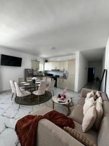 a living room with a couch and a table at Apartamentos SCARLEM in Higuey
