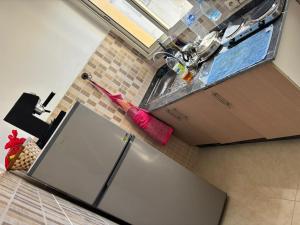 an overhead view of a kitchen with a sink at Appartement entier 1min de la plage sable d'or in Tangier +1 photo