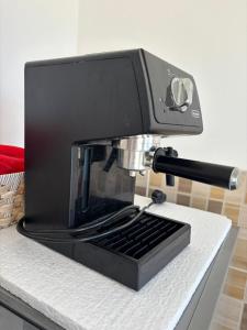 a coffee maker sitting on top of a counter at Appartement entier 1min de la plage sable d'or in Tangier