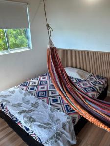 a bedroom with a hammock hanging over a bed at Villa Magdalena y Puerto Perales in La Piedad