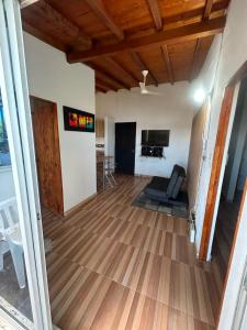 a living room with a hard wood floor at Villa Magdalena y Puerto Perales in La Piedad