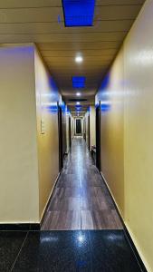 a hallway of an office building with a long corridor at Hotel Raj Palace in Āzamgarh