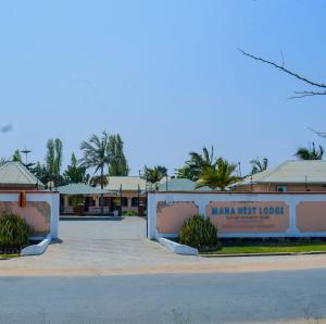 a parking lot in front of a hotel at Mana Nest Lodge in Choma +6 photos