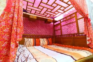 Voodi või voodid majutusasutuse Time Travelodge Homestay toas