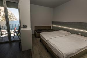 Campione Univela Rooms & Beds - Private Beach房間的床
