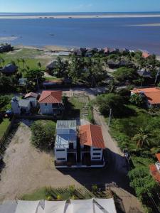 an aerial view of a house on the beach at Villa Fênix Suítes in Barreirinhas
