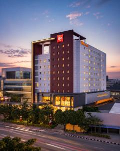 a hotel with a sign on the side of a building at Ibis Surabaya City Center in Surabaya