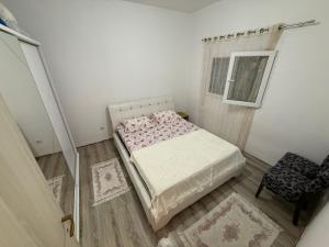 a small bedroom with a bed and a window at Old Town view apartment in Bar