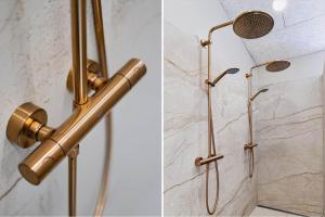 a shower with a golden handle and a shower head at 839-Harboore-Strandvaenget-6 in Harboør +34 photos