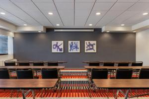 a conference room with wooden tables and chairs at Garner Hotel Wadsworth by IHG in Wadsworth +44 photos
