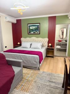 a bedroom with a large bed and a mirror at Pousada Lumiera House in Foz do Iguaçu