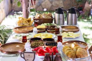 a table with a buffet of food on it at Kaya Apart Datca in Datca