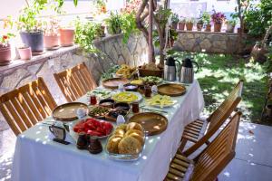 a white table with food on top of it at Kaya Apart Datca in Datca +58 photos