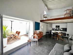 a living room with a couch and a dining room at Villa Nooma Elvas in Elvas