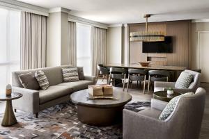 a living room with a couch and a table at San Antonio Marriott Rivercenter on the River Walk in San Antonio