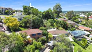 an overhead view of a suburb with houses and trees at Avalon 2 in Nambucca Heads +4 photos