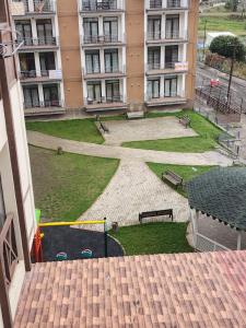 a view of a park in front of a building at bakuriani mix 504 in Bakuriani