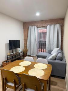 a living room with a table and a couch at Casa Zaabi in Oaxaca City