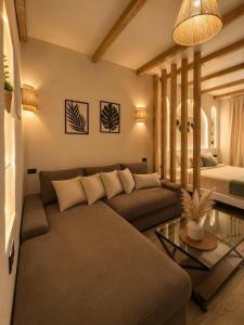a living room with a couch and a bed at La Hacienda Ras Sedr in Ras Matarma +11 photos
