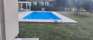a swimming pool in the yard of a house at 3a kuca Bajevac in Bajevac