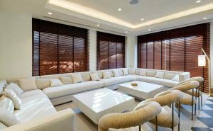 a living room with a white couch and chairs at Sercotel Pozuelo in Pozuelo de Alarcón