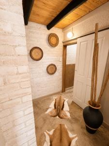 a room with a dog laying on the floor next to a door at Singwe Private Safari Lodge Kruger in Marloth Park +59 photos