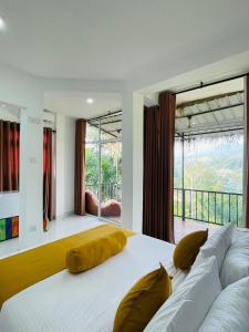 a bedroom with a large white bed with yellow pillows at Ella Hillcrest Heaven-Free Pickup from Ella in Ella +78 photos